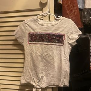 DKNY light grey tee with sequins and tied front.